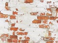 Red, Terracotta and White Brick Background. Old Wall of Red Bricks and White Brayed and Cracked Old Paint. Royalty Free Stock Photo