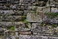 Old wall and stairs made of roughly machined natural stone blocks Royalty Free Stock Photo