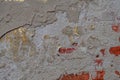 Old wall for texture or background, rough aged surface, remnants of peeling plaster, multi-colored grunge-style Royalty Free Stock Photo