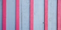 Old wall texture wooden aged panel grey blue wood background with pink red stripes Royalty Free Stock Photo