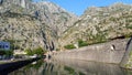Old wall of old town Kotor in Montenegro and light gray mountains