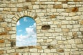 Old wall with window and view of the clouds Royalty Free Stock Photo