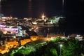 The old walled town of Budva is on peninsula in Adriatic sea at night light. City beach the Ricardova Glava. Top view. Montenegro Royalty Free Stock Photo