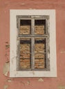 Old walled window with wooden frame close up