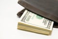 Old wallet with banknotes of US dollars inside Royalty Free Stock Photo