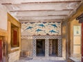 Old walls with Dolphin fresco, symbol of minoan culture. Knossos palace ruins at Crete island, Greece. Famous Minoan palace of Royalty Free Stock Photo