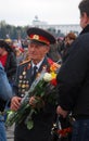 Old war veteran with flowers, Victory Day