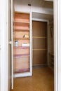 Old wardrobe in the interior of an apartment hallway with an outdated poor interior