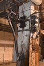 Plumbing, techology, wire, and electrical circuits in the basement of an old warehouse.