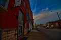 Old warehouse district brick buildings along a Kansas city MO street sith the downtown skyline Royalty Free Stock Photo