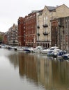 Old warehouse and new appartments on Bristol waterfront with smart boats Royalty Free Stock Photo