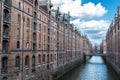 Old warehouses next to a canal in HafenCity, Hamburg, Germany Royalty Free Stock Photo