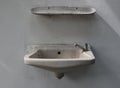 Old washbasin that is broken doesn`t work Royalty Free Stock Photo