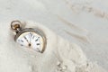 Old watch in the sand Royalty Free Stock Photo