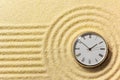 Old watch on surface of golden sand Royalty Free Stock Photo