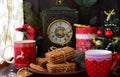 Old watches, mugs red New Year `s Eve, Christmas tree and tea, cookies and tea, Christmas, new year Royalty Free Stock Photo