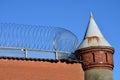 Old Watchtower With Barbwire On A Prison Wall