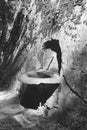 An old water fountain dug in the rock at the bottom of the Tamina Gorge near Bad Ragaz in Switzerland - 2