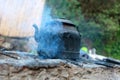 An old water kettle on the fireplace Royalty Free Stock Photo