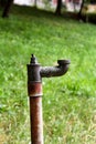 Old water pipes outside / Faucet with nature background / A old rusty water tap in garden Royalty Free Stock Photo
