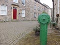 An old water pump on a back street at Alston Cumbria UK