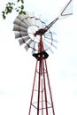 Old water pump windmill in a farm Royalty Free Stock Photo