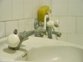 Old water spigot, sink in bathroom Royalty Free Stock Photo