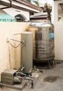 An old water storage tank and vintage water pump