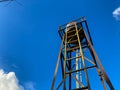 old water tank with clear blue sky background Royalty Free Stock Photo