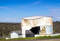 Old water tank with ripped open side Royalty Free Stock Photo