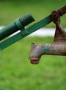 The old water tap in the garden Royalty Free Stock Photo