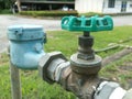 Old water valve and water meter Royalty Free Stock Photo