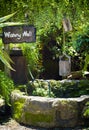 Old water well with bucket Royalty Free Stock Photo