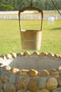 Old Water Well With Pulley and Bucket. Royalty Free Stock Photo