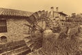 Old water wheels of a watermill. Vintage style picture.