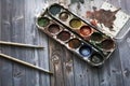 Old watercolor paints and brushes Royalty Free Stock Photo