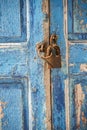 Old waterfront house shutter and padlock Mykonos Town Greece