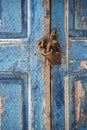 Old waterfront house window and padlock Mykonos Town Greece