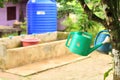 Old watering can in rural scene