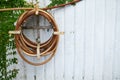 Old watering hose hang on the concrete wall. Royalty Free Stock Photo