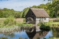 Old Watermill in an agrarian landscape at Kulturens Ãâstarp, a genuine open air museum in Blenterp, Sweden