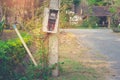 Old watthour meter of electricity for use in home appliance on electric pole at village. Royalty Free Stock Photo