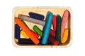 Old wax crayons in the box, isolated against white background Royalty Free Stock Photo