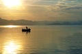 Sailing and fishing the old way of fishing at sunset