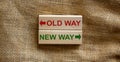 Old way vs new way, improvement and change management business concept. Wooden blocks on beautiful canvas background