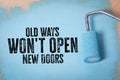 Old Ways Won't Open New Doors. Blue paint and paint roller on wooden background Royalty Free Stock Photo