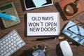 Old ways won`t open new doors on notepad. Motivational quote Royalty Free Stock Photo