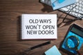 Old ways won`t open new doors on notepad. Motivational quote Royalty Free Stock Photo