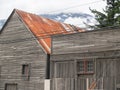 Old weatherboard building, unpainted and weathered with rusty roof