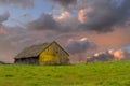 Old weathered abandoned barn in a field Royalty Free Stock Photo